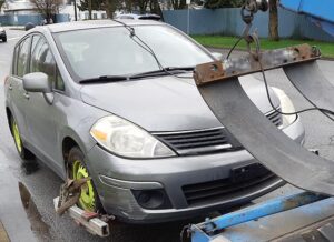 cash for cars 2004 Versa being towed