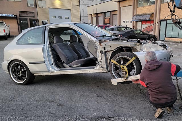 Scrap car removal in Vancouver of a 2000 Honda Civic hatchback.